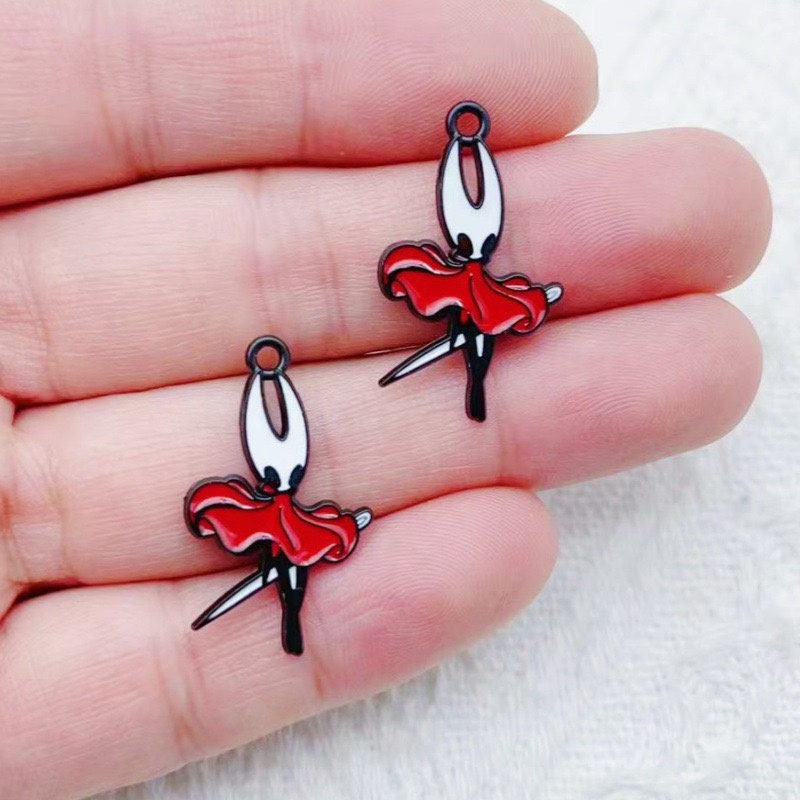 10 pendentifs en alliage motif - Party Games Spy avis et prix