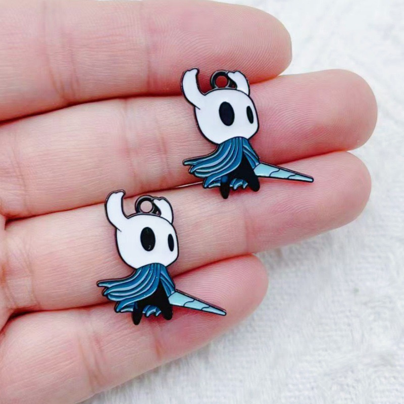 10 pendentifs en alliage motif - Party Games Spy avis et prix